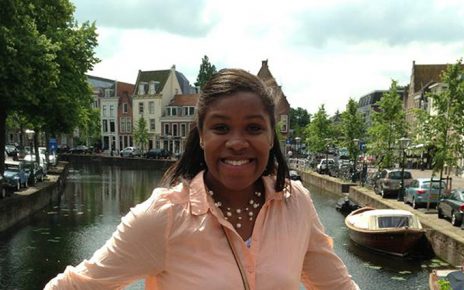 Tia Paulette poses in front of a river in Leiden, Holland.