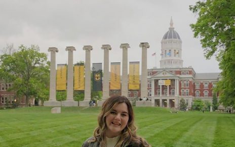 Karlee Resler-Seek stands in front of the Columns on Francis Quadrangle at the University of Missouri.