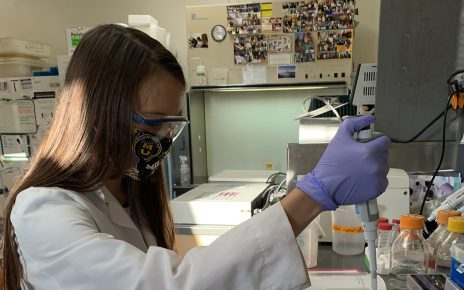 Tessa Jennings works in a lab on MU's campus.