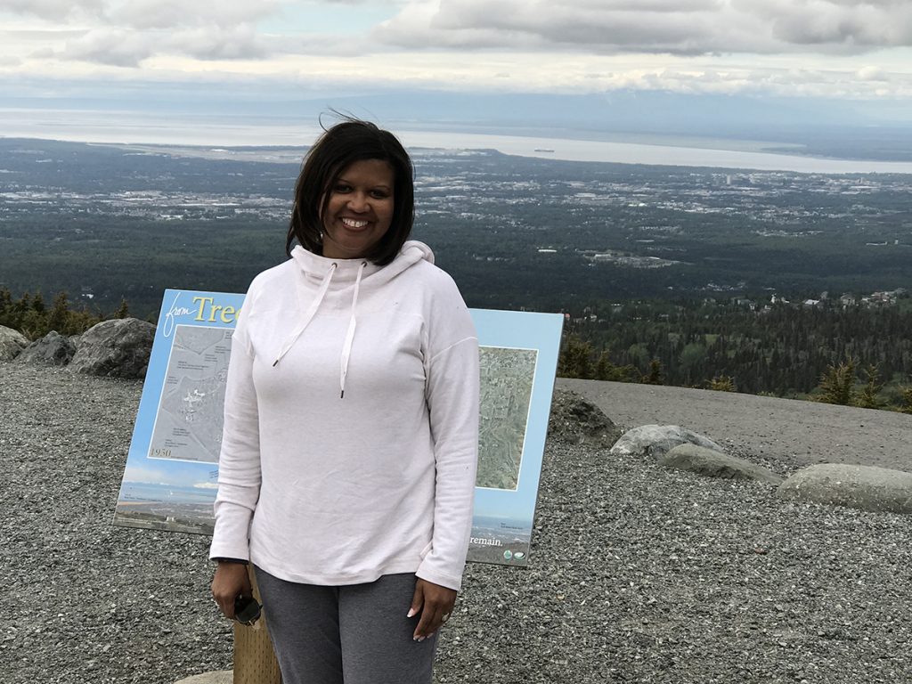 Tia Brown McNair stands atop Flattop Mountain, just east of Anchorage, Alaska.