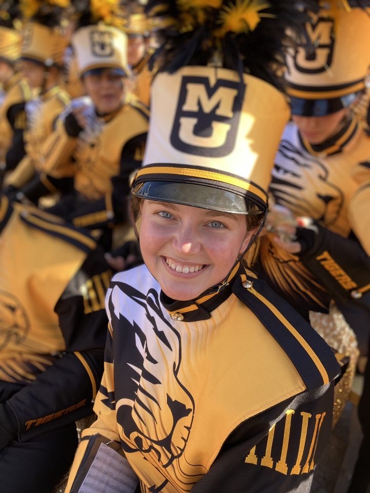 Elizabeth Busch smailing at the camera as she wears her Marching Mizzou uniform