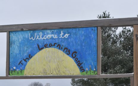 Claire Ames in front of the Learning Garden