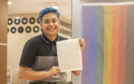 Amos Jaimes, holding a piece of his art.